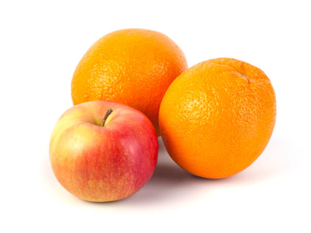 istock Apples and orange on white background, healthy diet 1130161082