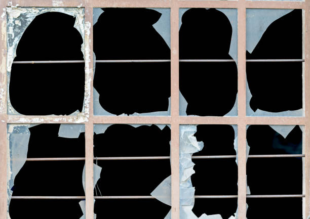 istock Old window with broken panes of glass 1130164104