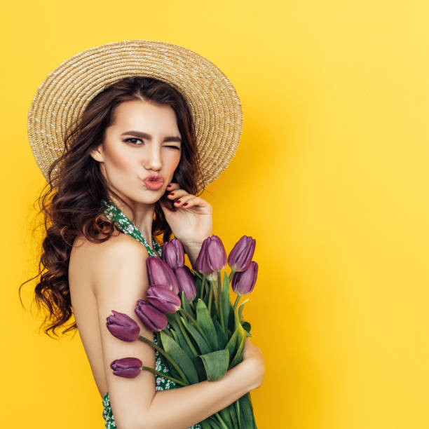 istock Lovely woman with tulips bunch 1130165365