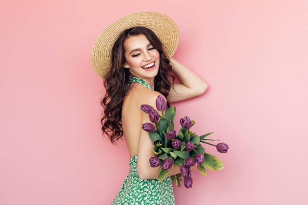 Lovely woman with tulips bunch
