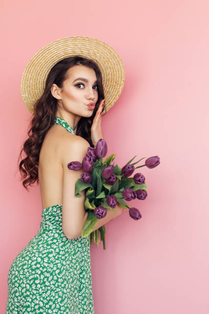 istock Lovely woman with tulips bunch 1130165492