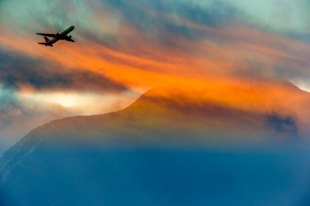Airline leaving Maui at sunrise seen from Hookipa Beach