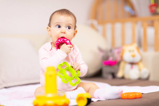 istock Baby girl having fun at home 1130170735