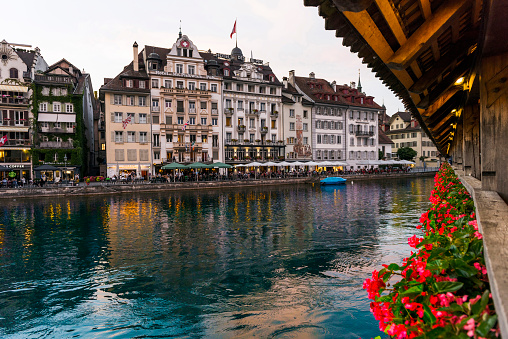 View of the historic luzern town from Chapel Bridge at sunset in Switzerland.
