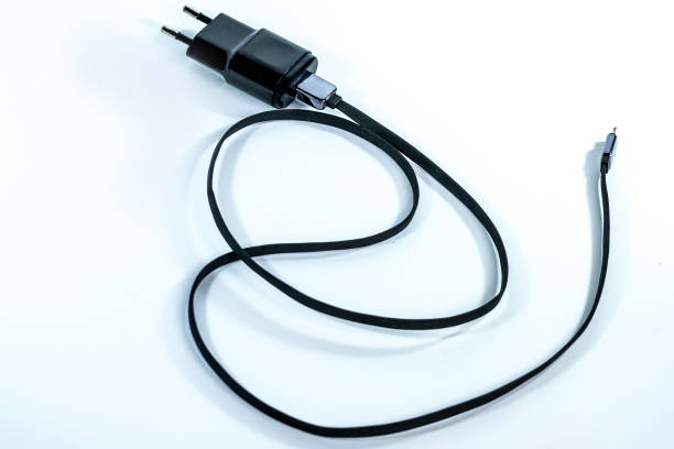 istock Black electrical charger for mobile phones 1130184801