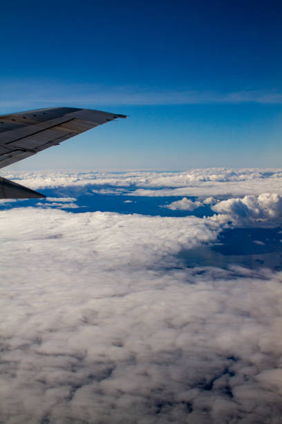 istock Beautiful blue sky and clouds from plane window somewhere over the pacific 1130186624
