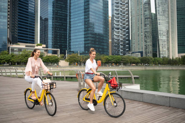 istock Girlfriends biking in the city 1130187740