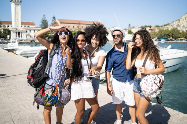 istock Tourists walking on street 1130187841