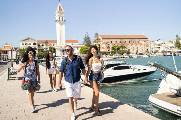 istock Couple walking on street with friends 1130187848
