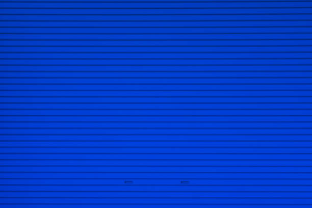 istock Metal roller shutter door or gate wall closed background. 1130188003