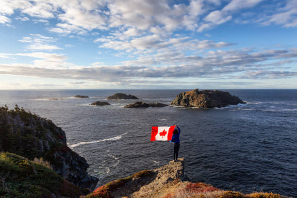 istock Woman by the ocean cliff 1130189523