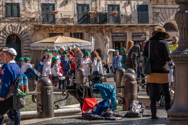 Tourists and residents in Piazza Navona, one of the most famous and beautiful travel destinations in Rome, Italy.