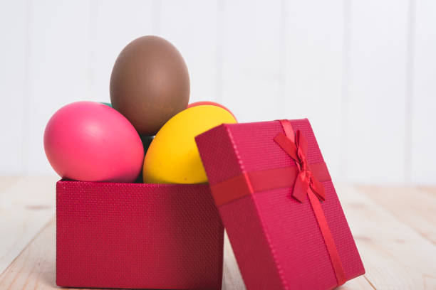 Easter eggs clean in red box gift on wooden background, easter day concept