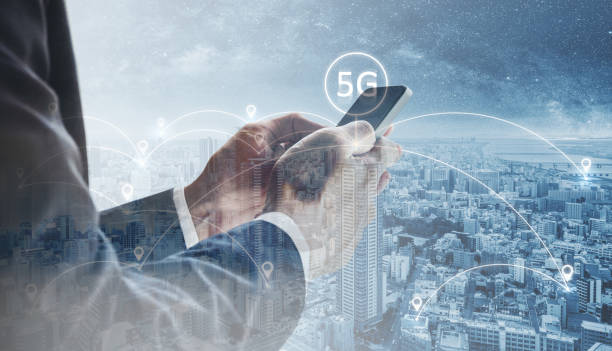 istock Double exposure, Businessman using mobile smart phone with cityscape and 5G sign 1130206255