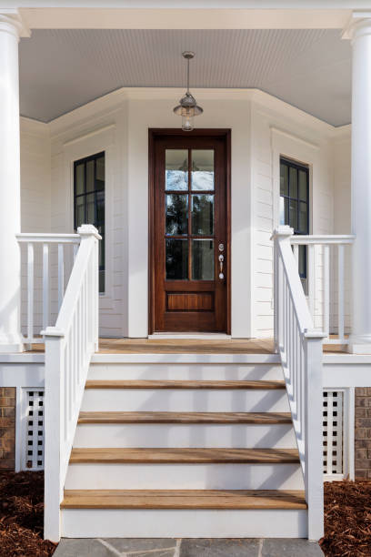 exterior of a house showing the front door - alpendre imagens e fotografias de stock