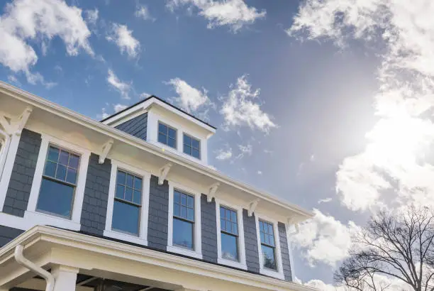 Photo of Exterior view of a house with lots of windows