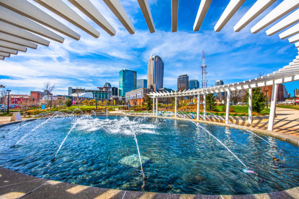 Charlotte North Carolina Skyline from First Ward Park Fountain Charlotte North Carolina Skyline from the First Ward Park Fountain university of north carolina photos stock pictures, royalty-free photos & images