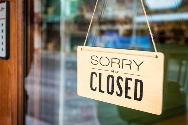 Sorry we are closed sign board hanging on door of cafe Sorry we are closed sign board hanging on a door of cafe shut up stock pictures, royalty-free photos & images