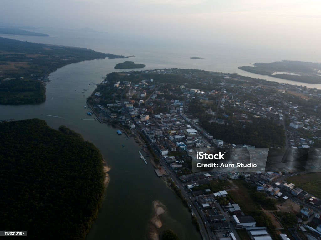 Aerial view on Krabi town river in Thailand. Trees, green rocks near the river. Image from drone of river in Krabi town, Thailand. Green trees, mountains and rocks around river. Andaman Sea Stock Photo