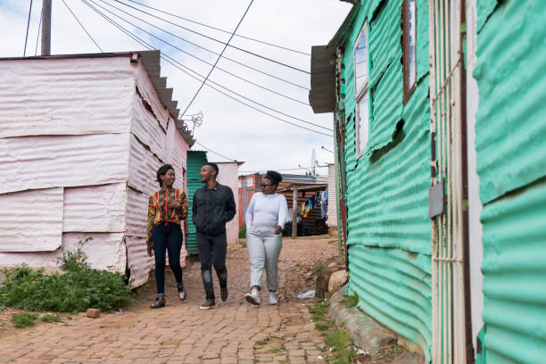 istock Friends walking through the township together 1130212101