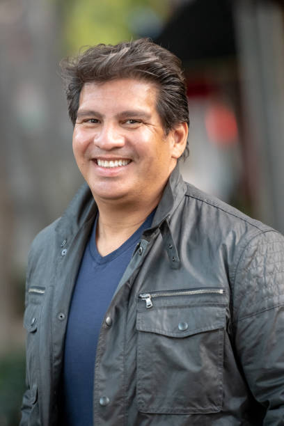 istock Smiling hispanic mature man looking at the camera 1130212140