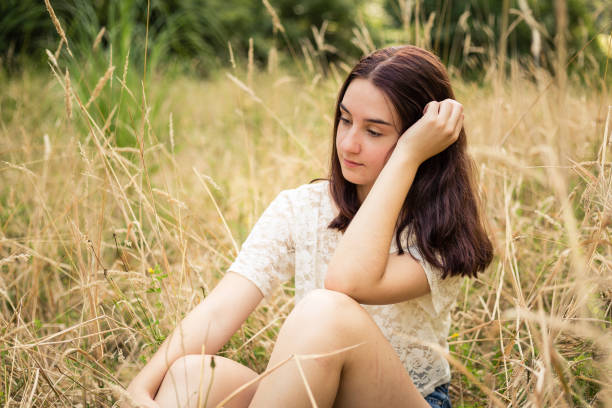 istock Young woman relaxing in the sun 1130216822