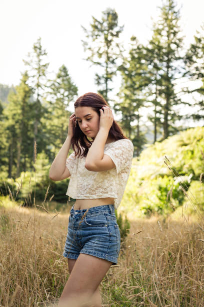 istock Young woman relaxing in the sun 1130216834