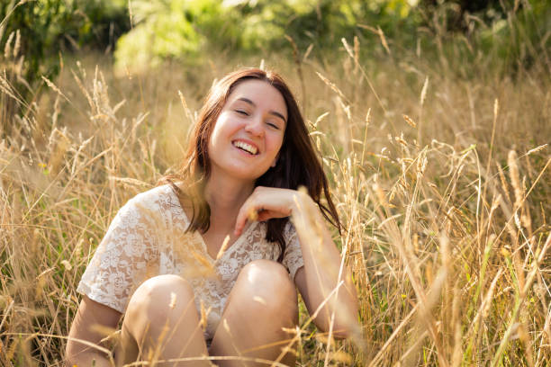 istock Young woman relaxing in the sun 1130216882