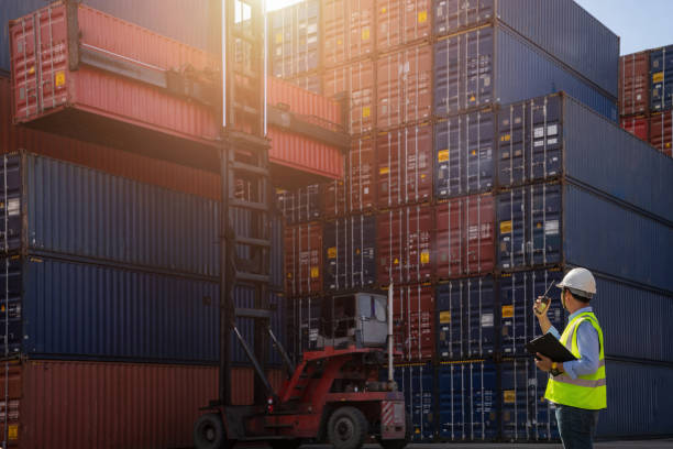 istock Foreman control loading Containers box to truck for Logistic 1130216909