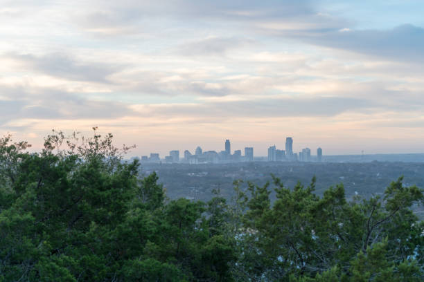 istock Downtown Austin Skyline Peaking on Top of Trees From the Distance 1130218255