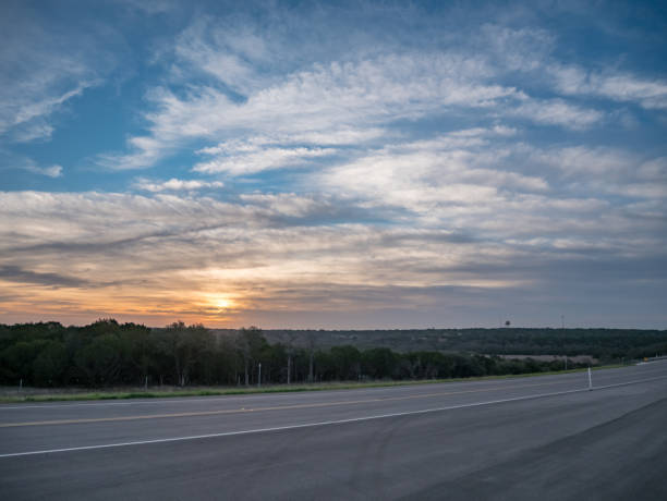 istock Sunrise Over New Texas Road 1130218325