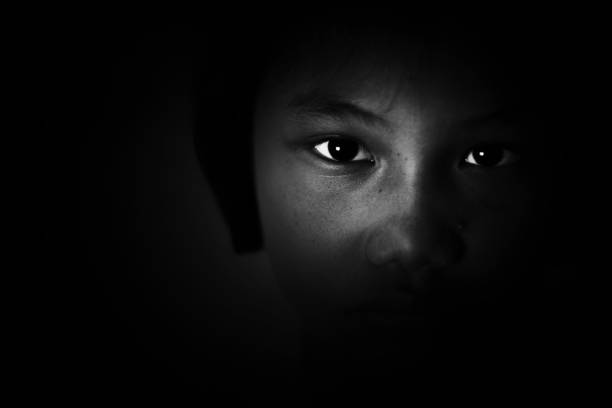 sadness and depress girl, absent minded, Child Abuse in white tone sadness and depress girl, absent minded, Child Abuse in white tone people trafficking stock pictures, royalty-free photos & images