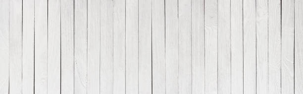 istock Wood table painted white, wooden texture of a panoramic view 1130220151