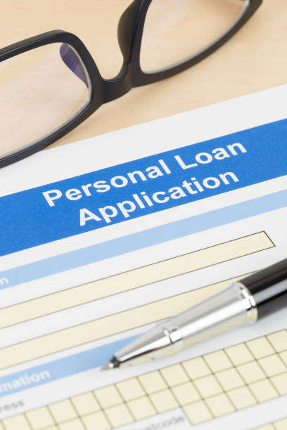 istock Personal loan application form with glasses, and pen 1130222178