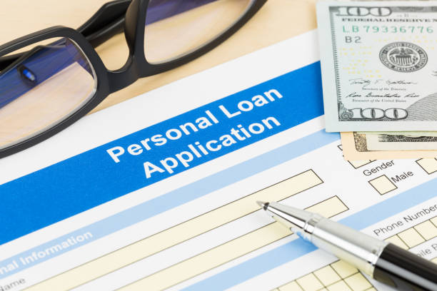 istock Personal loan application form with glasses dollar money, and pen 1130222185