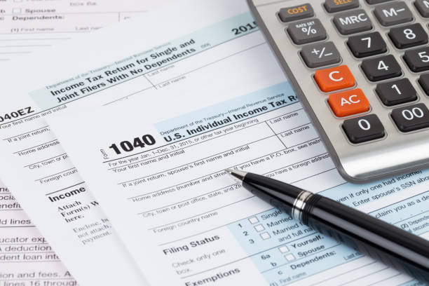 istock Tax form with pen and calculator 1130222791