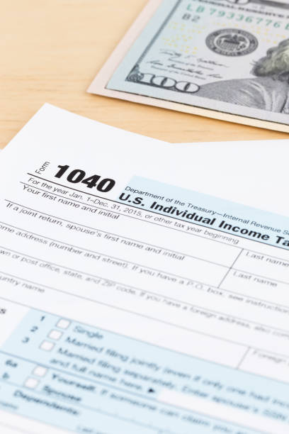 istock Tax form with dollar banknote 1130222799