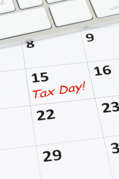istock Tax day on calendar with keyboard 1130223224