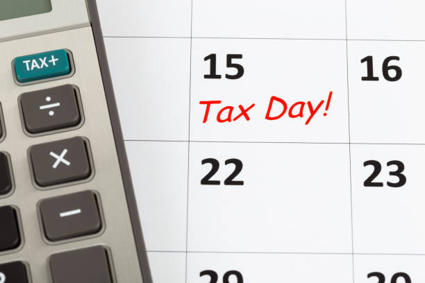 istock Tax day on calendar with calculator 1130223235
