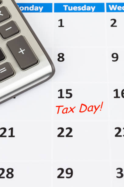 istock Tax day on calendar with calculator 1130223238