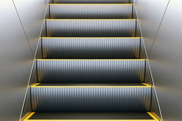 Photo of Metal escalator in modern office or public building, shopping mall, airport, railway or metro subway station