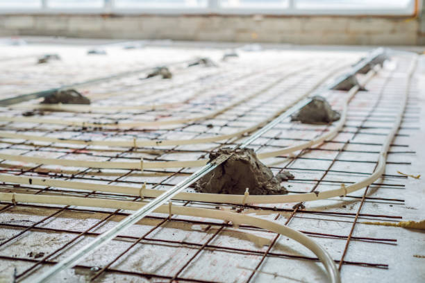 istock Pipe fitter mounted underfloor heating. Heating system and underfloor heating 1130225123