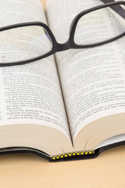 istock Glasses on holy bible page concept theology study 1130225980