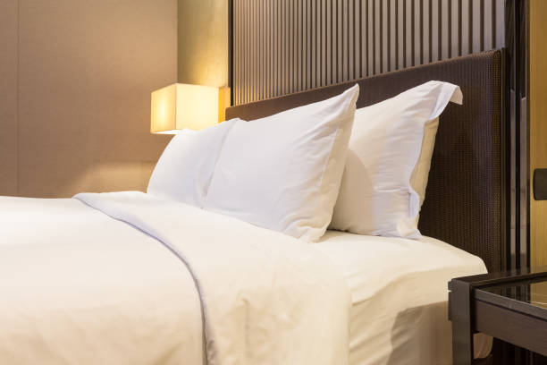 istock Luxury bed and pillow with warm light 1130226007