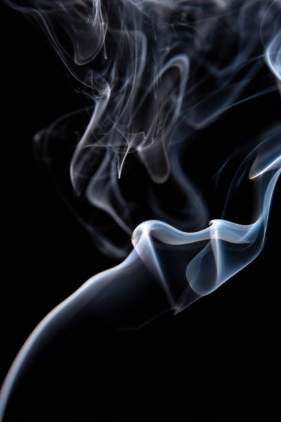 istock Abstract smoke isolated on dark background 1130229927
