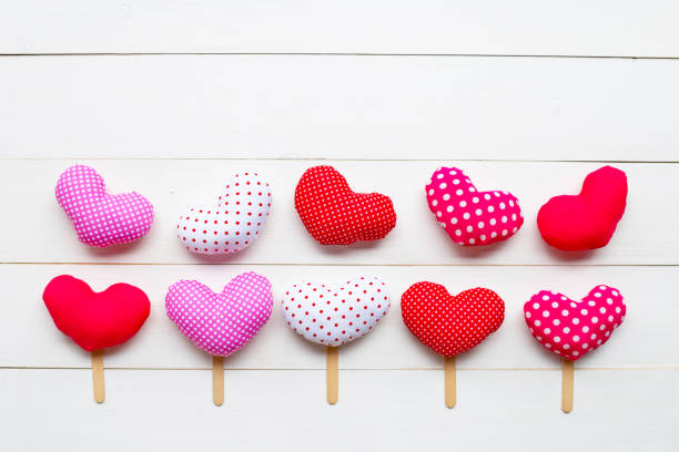 istock Valentine's hearts on white wooden background. 1130230038