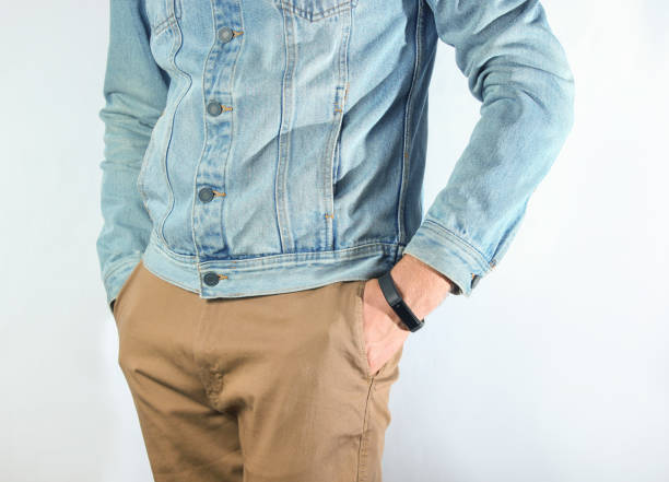 istock Fragment of a man dressed in a denim jacket 1130231240