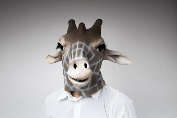 istock Portrait of man with giraffe mask 1130232983