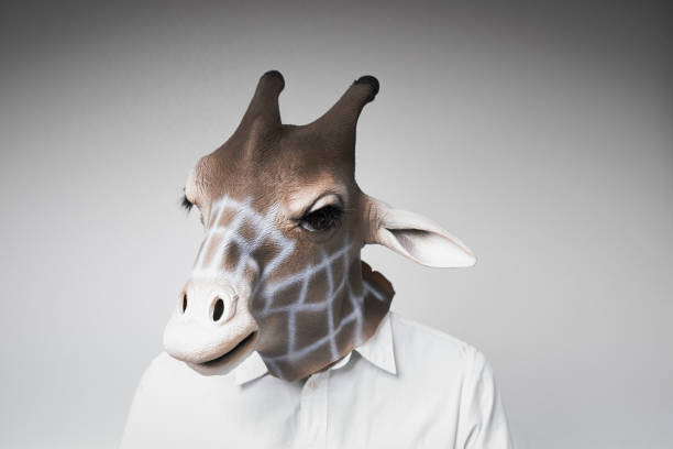 istock Portrait of man with giraffe mask 1130232984
