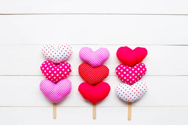 istock Valentine's hearts on white wooden background. 1130234071